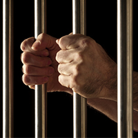 hands behind bars resized