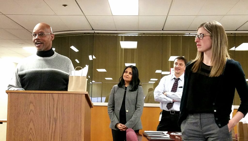 ACT Court graduate Tyrone speaks at the graduation ceremony as ACT Court Judge Neera Walsh and the ACT Court Probation Officers Joe and Caitlin look on.